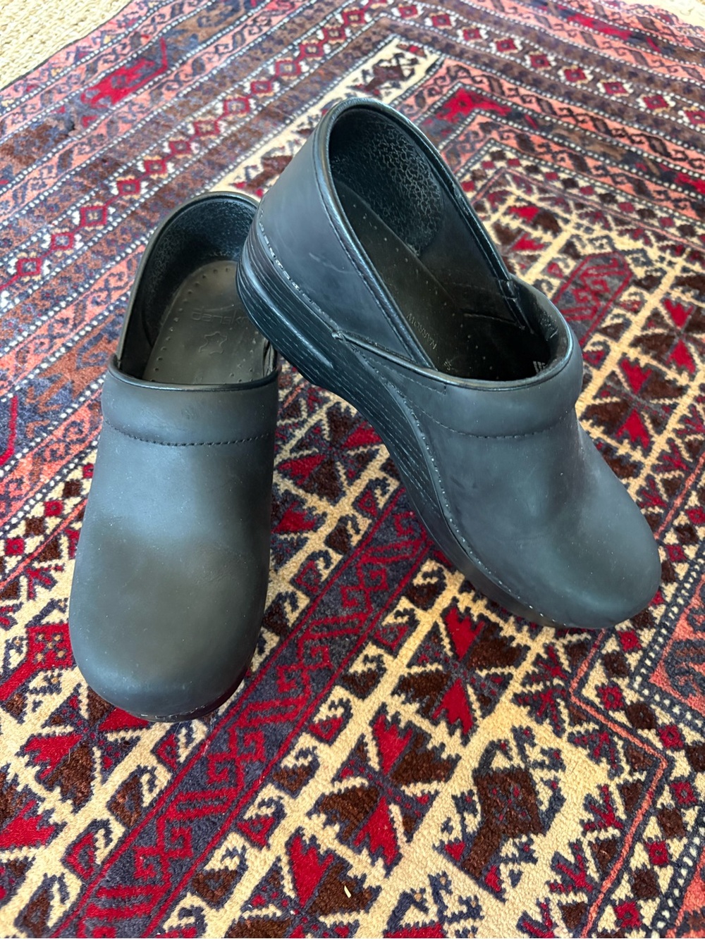 Dansko women’s Black Slip-On Clogs